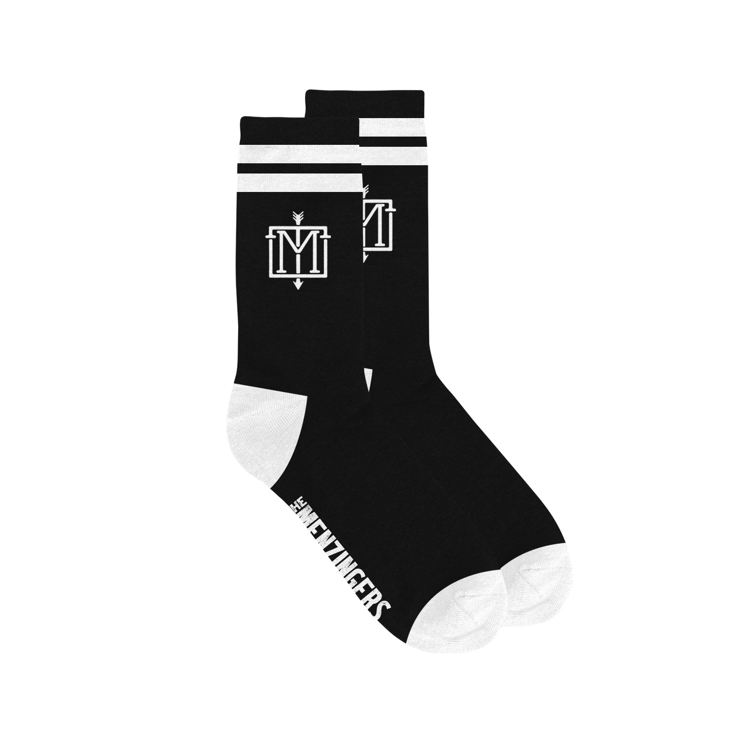 image of two socks on white background. socks are black with two white stripes at the top and white toes and heals. there is a white emblem with the letter M and an arrow down the center on the part of the sock that is above the ankle and it says the menzingers in white on the side bottom of the socks.