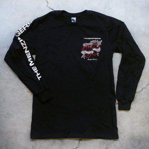 image of the front of a black long sleeve tee laid flat on a cracked concrete floor. there is a cream print on the left sleeve going down says the menzingers.right breast is a print with cream on top that says the menzingers & two hearts in red with a sword through them. the hearts have cream fire on top barb wire wrapped around. they are bleeding in cursive below strangers forever.
